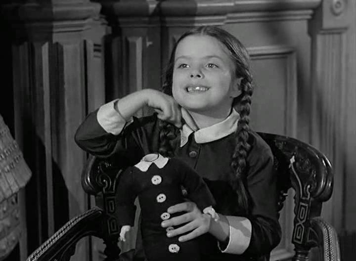Lisa Loring ในบท Wednesday Addams จากซีรีส์ The Addams Family ค.ศ. 1964-1966 (พ.ศ. 2507-2509)
